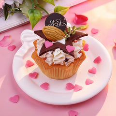 Miss Doozy white heart sprinkles on a dessert, adding subtle charm.