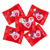 M&M’S WORLD heart favors set showing 30 festive Valentine bags ready for sharing.