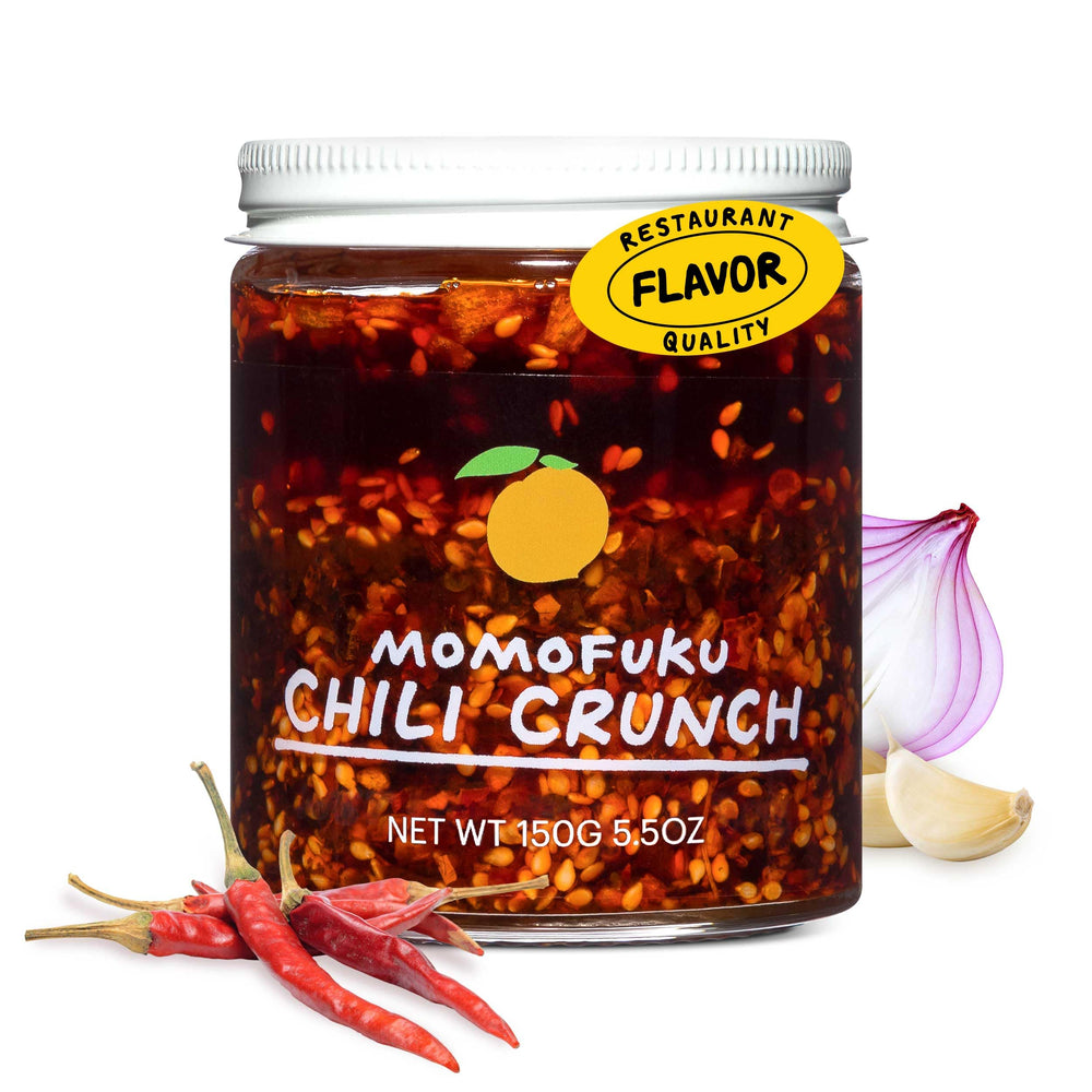 Momofuku Chili Crunch jar close-up highlighting rich color and crunchy garlic-shallots for bold meals.