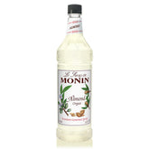 Monin Almond Syrup bottle pour with rich nutty notes for coffee