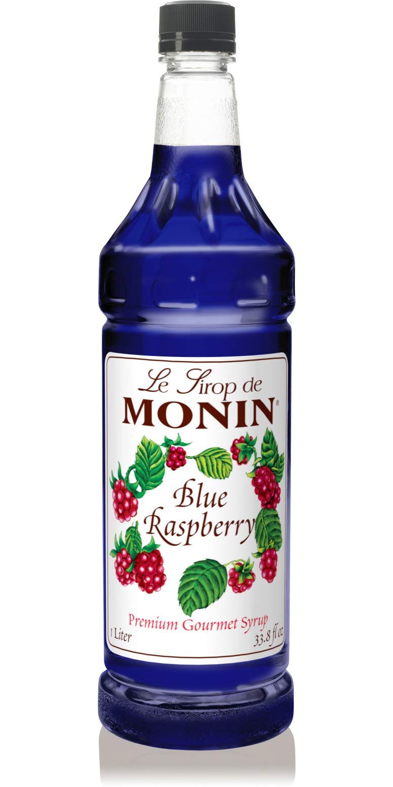 Monin Blue Raspberry Syrup bottle adds vibrant color and bold berry flavor to drinks.
