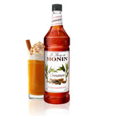 Monin Cinnamon Syrup bottle showcases bold aroma for coffee and drinks.