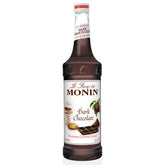 Monin dark chocolate syrup bottle, velvety flavor ideal for coffee and desserts