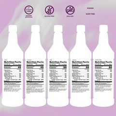 Monin Lavender bottle beside glass adds semi-sweet notes to beverages