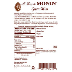 Glass with Monin Green Mint Syrup showing rich green hue for refreshing drinks