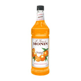 Monin Orange Syrup bottle pour for cocktails and desserts.