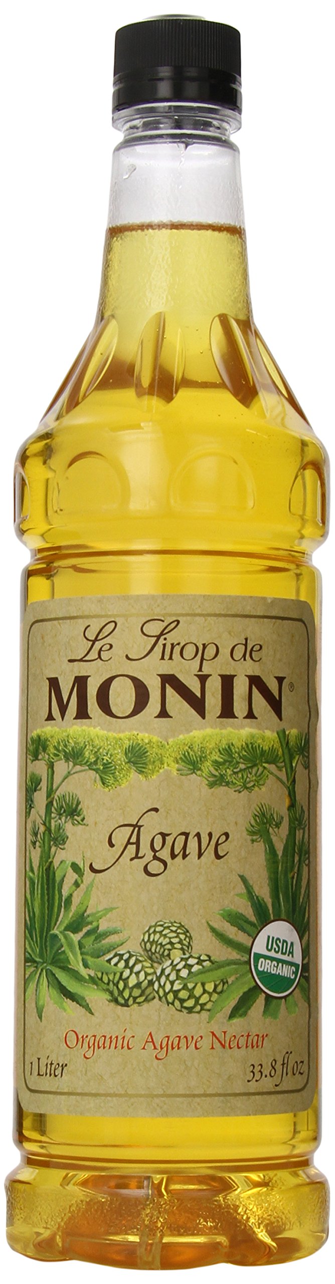 Monin Organic Agave Syrup bottle on a kitchen counter, ideal for versatile beverages