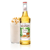 Monin Peanut Butter Syrup bottle pour for a creamy beverage