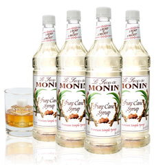 Monin Pure Cane Syrup bottle pouring into coffee for a clean sweetness