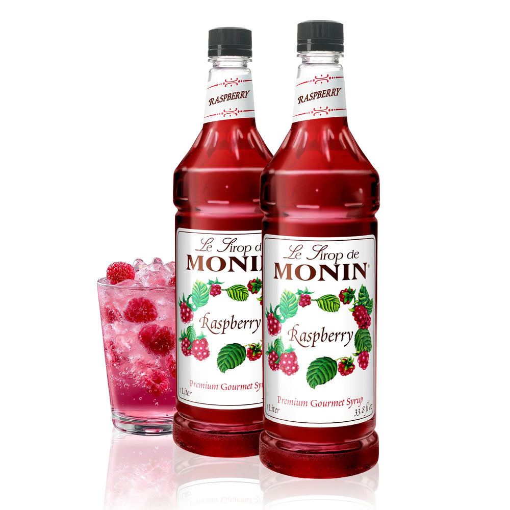 Monin Raspberry Syrup bottle with vibrant label, ideal for cocktails.