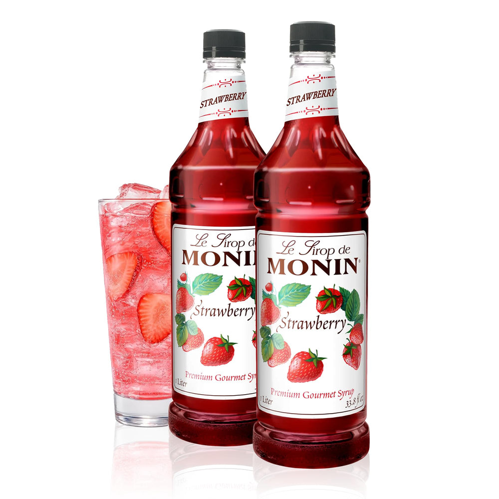 Monin Strawberry Syrup bottle shows a vibrant red hue for cocktails and teas.