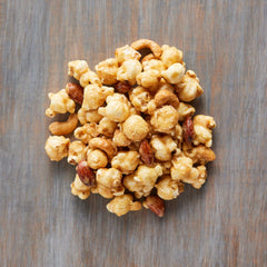 Close-up of Moose Munch Milk Chocolate and Caramel Popcorn, perfect for sharing during movie night.