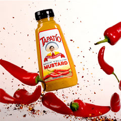 Morehouse Tapatio spicy yellow mustard on hot dogs for extra heat