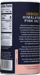Morton pink salt dusting over dish to finish flavor