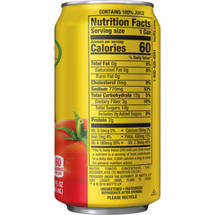 Pouring Mott's tomato juice into a glass for bold recipes