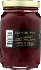 Close-up of Mountain Fruit Co Raspberry Tart Jam texture with fruit pieces.
