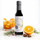Muddy River Aromatic Bitters bottle label; handcrafted small-batch flavor.