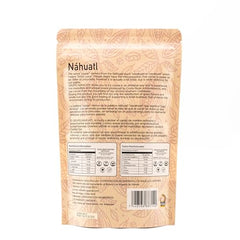 Nahuatl cacao beans in hand, convenient 100g portion for mindful snacking.