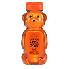 Nate's Honey bottle pour showing pourable, pure sweetness for tea and yogurt.