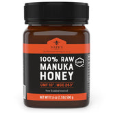 Nate's Honey raw Manuka bottle front view showing rich color for daily use.