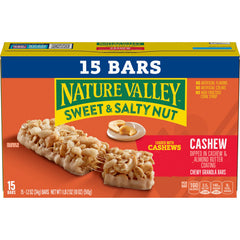 Person holding a Nature Valley bar, portable snacking on the go