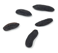 Naturegrail tonka beans in bowl demonstrate versatile flavoring for ice cream and baked goods.