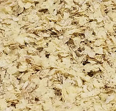 NatureJam RAW Wheat Germ pouring into a yogurt cup for a mild boost.