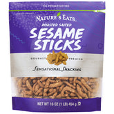 Nature's Eats Sesame Sticks 16oz pack on a wooden board, ideal for on-the-go snacking.