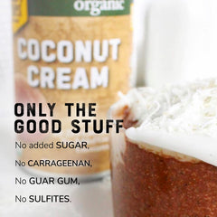 Pack of 12 Nature's Greatest Foods coconut cream cans on a kitchen shelf.
