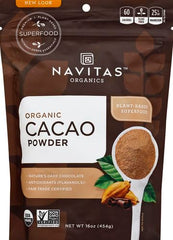 Pouring Navitas Organics cacao powder into a blender for smoothies.
