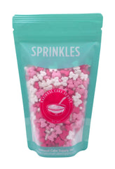 NCS light pink bows sprinkles add soft cake accents.