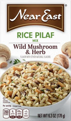 Cooked pilaf in a skillet showing fluffy rice and mushrooms