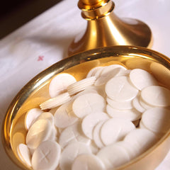Needzo communion hosts ready for orderly distribution during service.