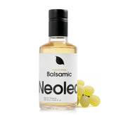Neolea White Greek balsamic vinegar bottle pour enhances sauces and salads.