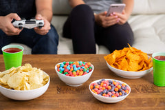 Nerds colorful candy pieces spilled in bowl, showcases flavor variety