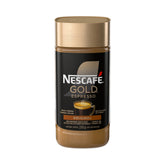 NESCAFE Gold Espresso Instant Coffee canister on a kitchen counter preserving freshness.
