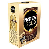 Nescafé Gold instant coffee packets in packaging provide quick premium aroma for mornings.