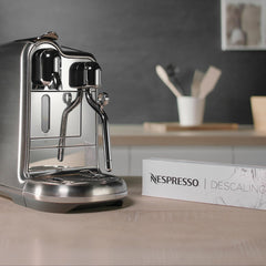 Nespresso descaling kit QR code guide image with simple video tutorial