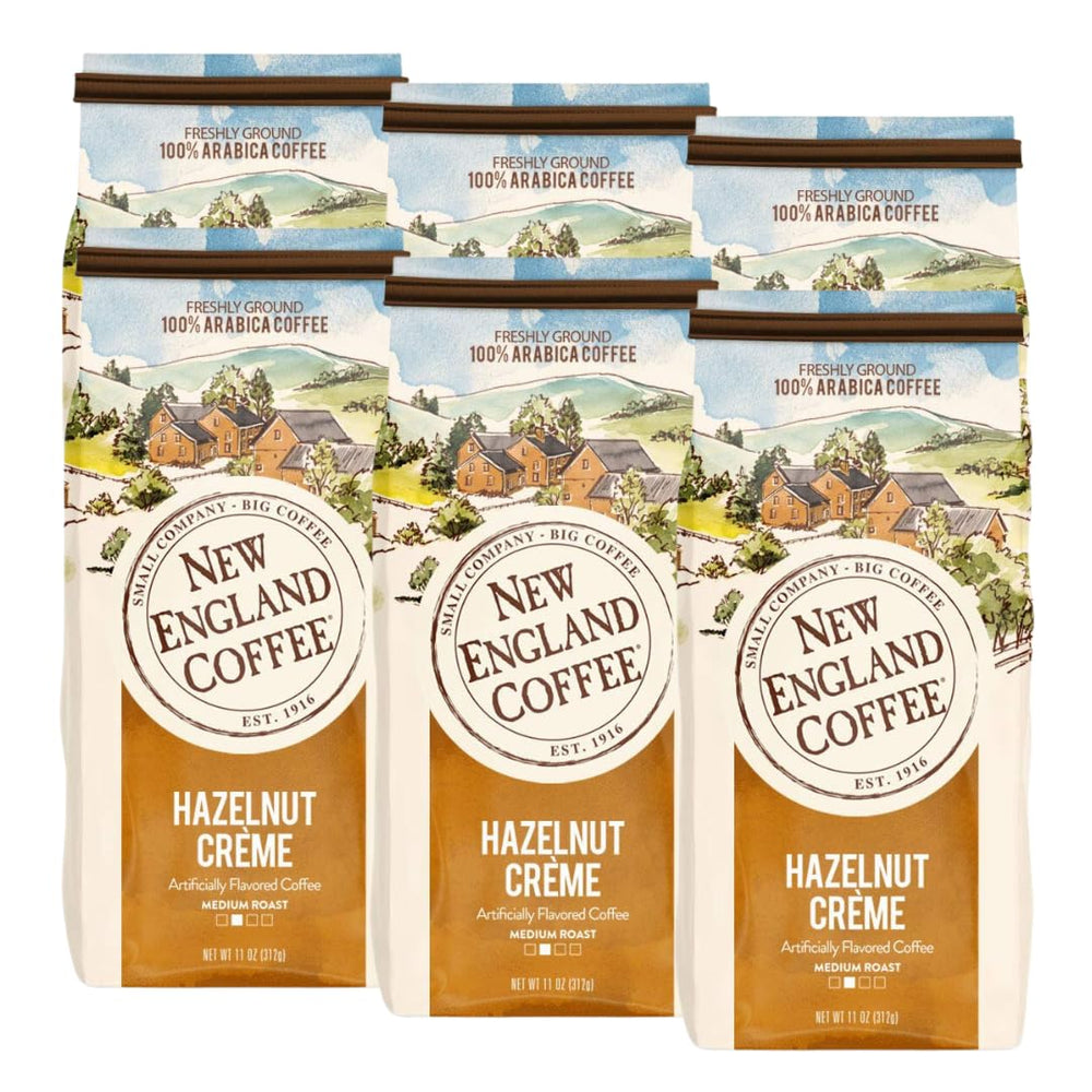 New England Coffee Hazelnut Crème ground coffee front view, 11oz six-pack, inviting aroma