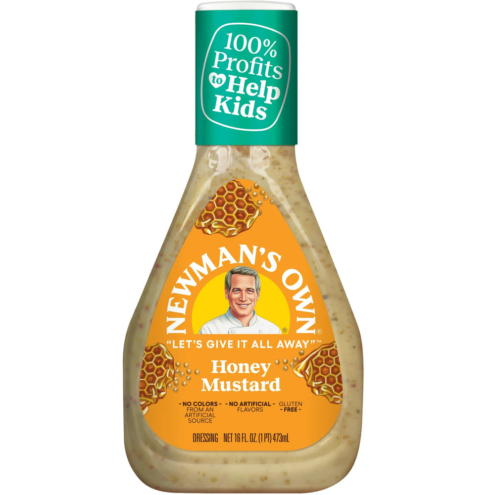 Newman's Own Honey Mustard Dressing bottle on greens, balanced sweetness.