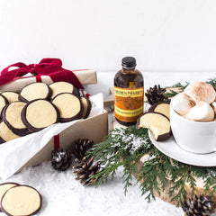 Nielsen-Massey Almond Extract used in dessert-baking prep