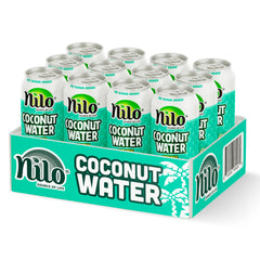 Pouring NILO coconut water with pulp into a glass for a tropical refreshment.