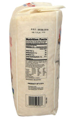Close-up of uncooked Nishiki Premium Sushi Rice grains for consistent texture