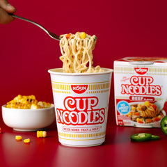 Nissin Cup Noodles Beef Flavor steaming bowl; inviting aroma and broth.