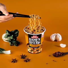 NISSIN Cup Noodles Ramen Bistro bok choy and carrot vegetables in cup.