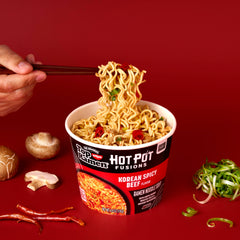 NISSIN Top Ramen HotPot Fusions Korean Spicy Beef microwave-ready bowl steaming.