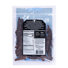 No Man's Land beef jerky slices close-up shows lean cuts for a high-protein bite.