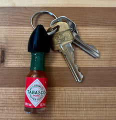 Nomad Enterprises mini Tabasco bottle on keychain for portable flavor on the go