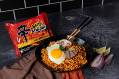 Nongshim Shin Ramyun Stir-Fry Square Bowl steaming, inviting ready-to-eat meal for quick gratification.