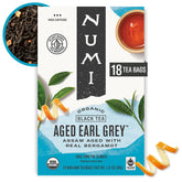 Numi Organic Aged Earl Grey tea bags reveal premium full-leaf aroma for a refined afternoon break.